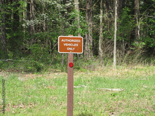 Authorized vehicles only entrance sign