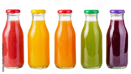 Fotografie Isolated refreshing fruit and vegetable juice drinks in a row, glass bottles with colorful caps