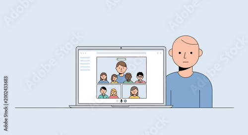 Man in blue shirt using laptop.