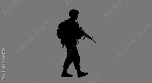 Foto Silhouette of a Soldier with Rifle and Backpack Walking