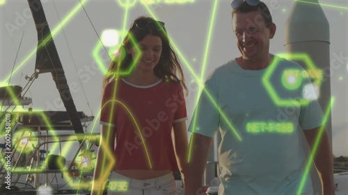 Dad placing arm on daughter walking dock as camera tightening tech hex overlay hiding faces bonding