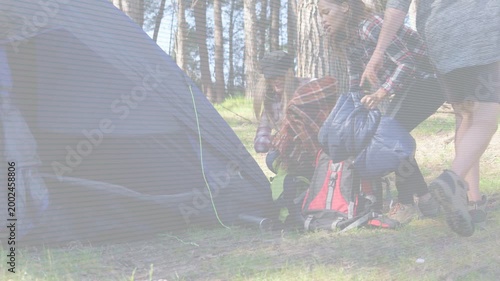 Camp crew arriving campsite unpacking red pack and blue bedrolls by tent, overlays guiding setup