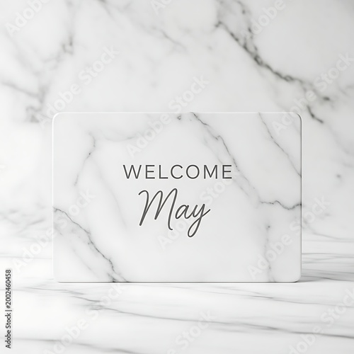 handwritten welcome may sign on white marble background with elegant script calligraphy