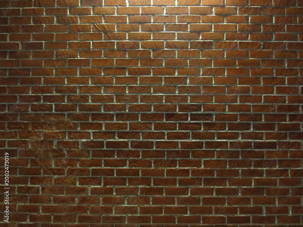 Fototapeta premium Retro Brick Wall Illuminated at Night Background