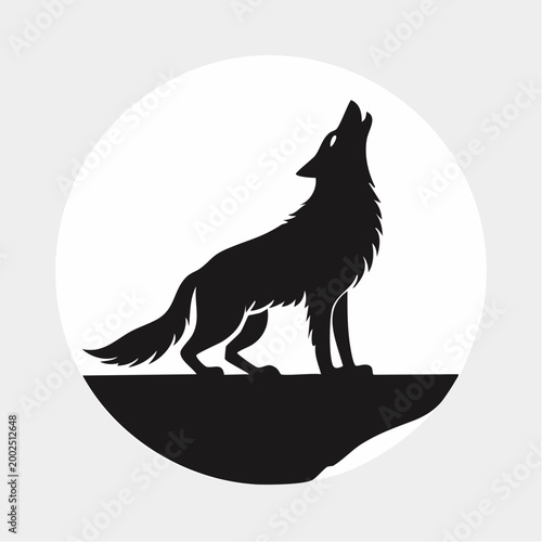 Silhouette of a wolf howling at the moon