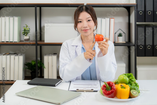 Portrait asian woman nutritionist working in medical clinic office, doctor specialist diagnosis planning nutrition, weight control for patient wellness, consultation for weightloss with meal plan.