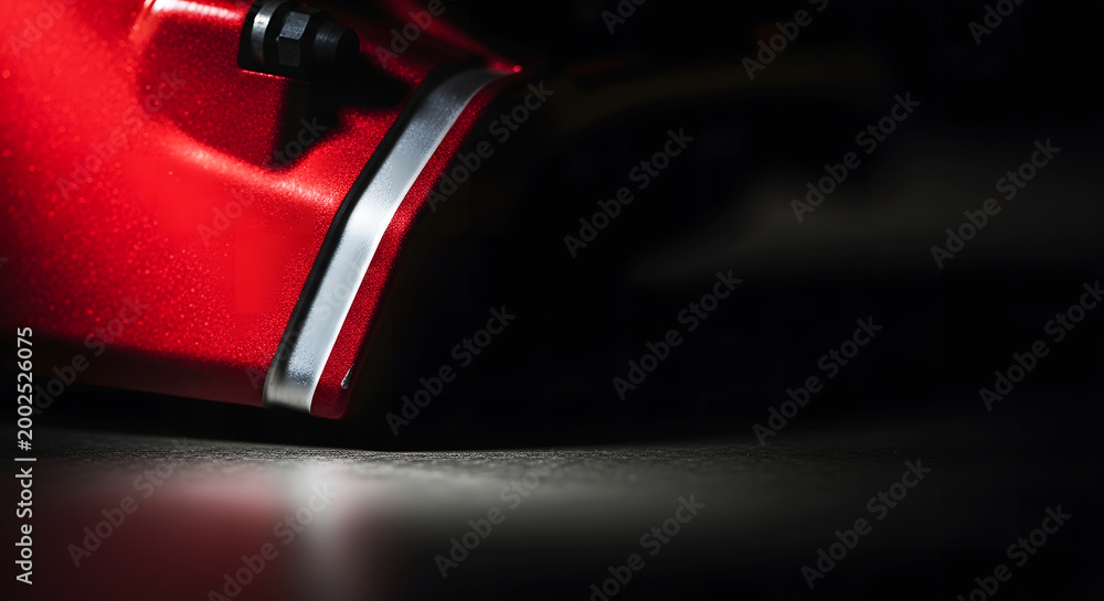 Naklejka premium Close-up of Red High Performance Brake Caliper on Sport Car