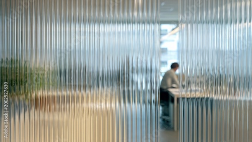 
Office behind fluted glass (also known as reeded glass or fluted glass), characterized by a series of parallel vertical lines