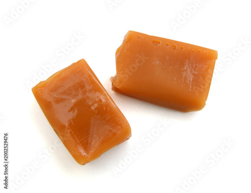 Caramel candies isolated on white background