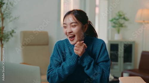 Happy asian girl feeling euphoric receiving good news on her computer. Young woman celebrating a victory, winning an online competition