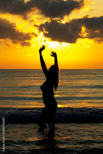 Woman with silhouette and sunrise morning