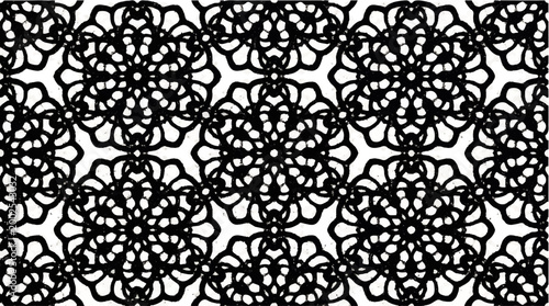 Intricate black lace pattern with repeating floral motifs on a white background, a detailed ornamental design