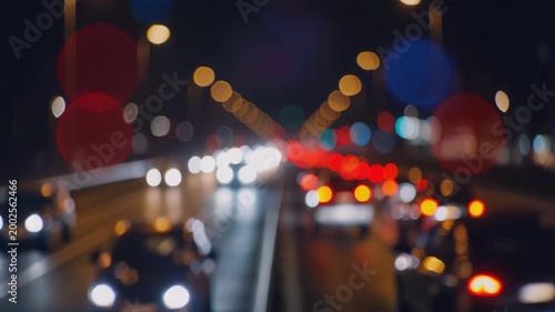 Nocturnal City Symphony: A mesmerizing display of bokeh lights dance amidst the blurry cityscape, weaving a tapestry of vibrant energy and nocturnal rhythm. Generative AI.