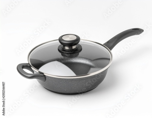Black nonstick saucepan with glass lid on white background