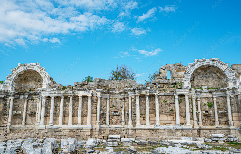 Fototapeta premium The scenic views of the nympheum, originally natural grottoes, which tradition assigned as habitations to the local nymphs in Side, Turkey.