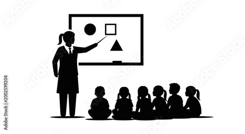 Teacher instructing a group of young students in a classroom setting.