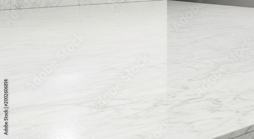 White marble countertop surface with subtle grey veining a clean and elegant background for luxury product displays or interior design concepts