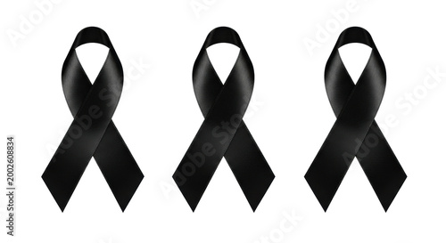 Three black satin awareness ribbons with fine texture and elegant sheen isolated on a transparent background in a macro studio shot mourning and grief concept