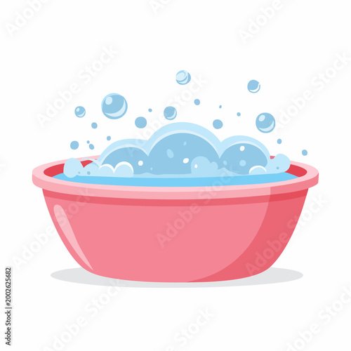 Pink basin filled with soapy water and bubbles