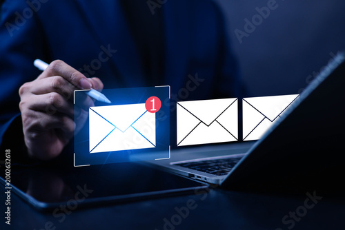 Fotografía Business professional using tablet and laptop with email notification interface,