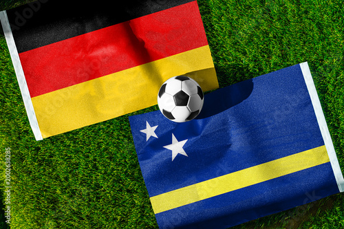 Fotografia Germany vs Curacao, national flags before world championship Group E group stage