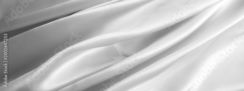 Black and white fabric background. Wrinkled cloth texture