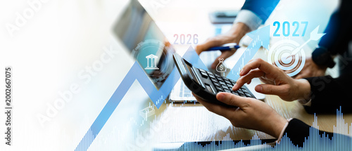 Business finance,growth 22027 and investment concept.Businessman calculating and analyzing financial data report with business graph growth chart and world economic,Banking,Stock,finance,Accounting.