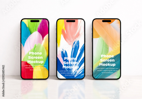 Three Smartphone Screen Mockups Standing in a Row on White Background with Colorful Feather Designs