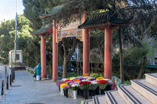 Istanbul Taksim Park Chinese Gate with Colorful Flower Stand, Pagoda Entrance and Trees, Turkey