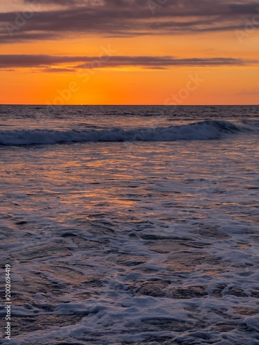 Εκτύπωση καμβά Portrait format view of a deep reddish-orange sky during the sunset afterglow in Carlsbad