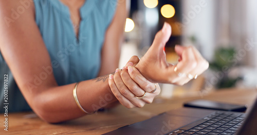Fotografie Hands, business and woman in office, wrist pain and discomfort with laptop, joint injury and sore