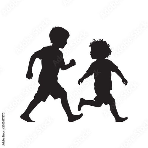 Silhouette of Two Young Boys Running and Playing Together in Active Motion.