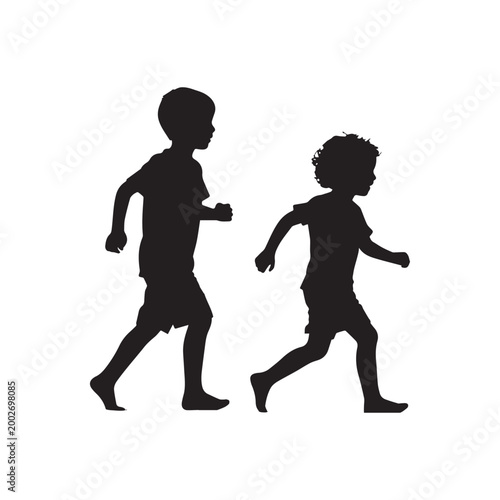 Silhouette of Two Young Boys Running and Playing Together in Active Motion.