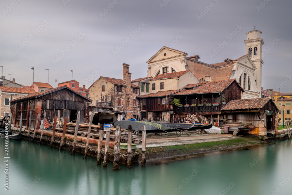 Obraz premium Venice Italy canals and gondola cityscape. Historic architecture and waterfront reflections create an iconic European travel destination.