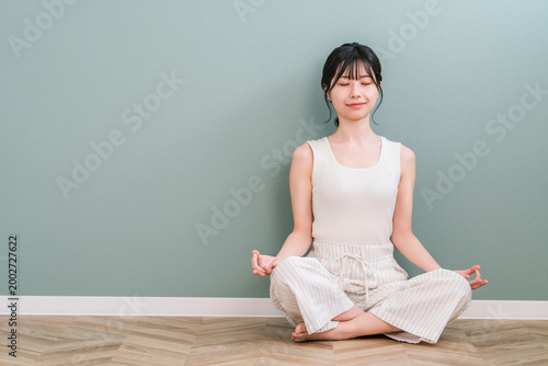 Konstfotografi A young Asian woman practicing yoga, meditation, mindfulness, and morning routin