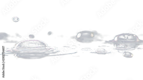 Billede på lærred Water drops create ripples on the surface during a moment of contact against a s
