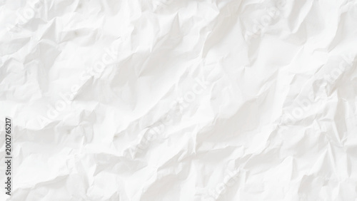 White crumpled paper texture background with folds and creases