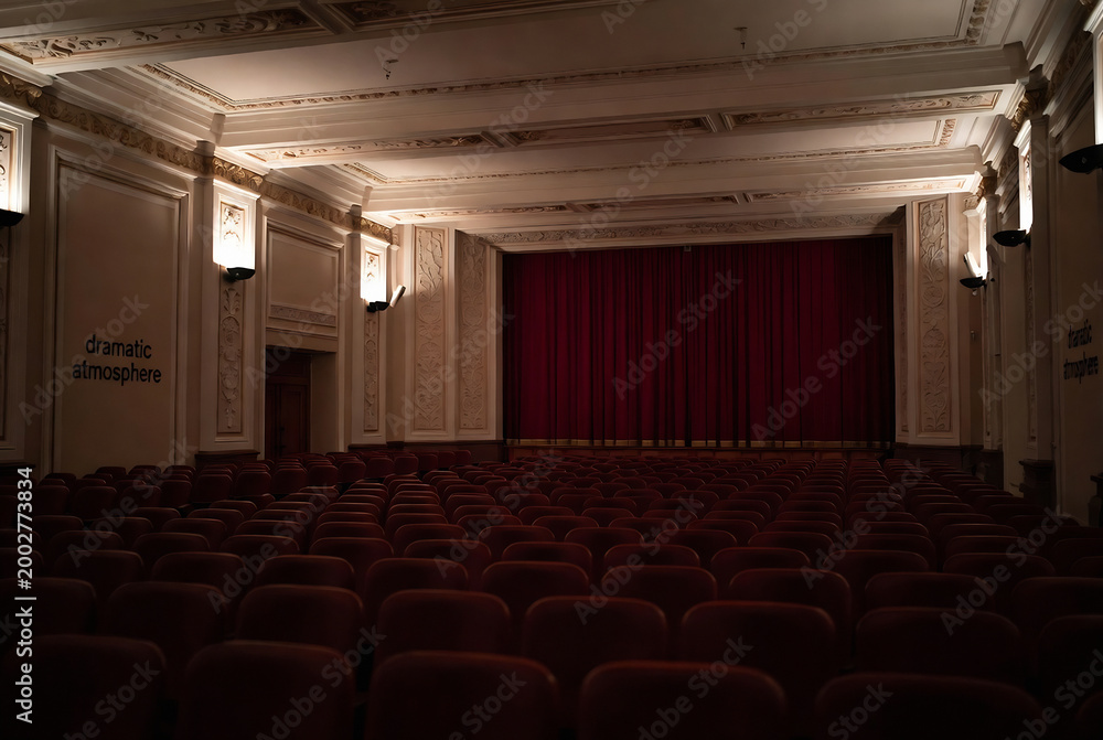 Fototapeta premium An empty theater with rows of seats, creating a dramatic atmosphere.