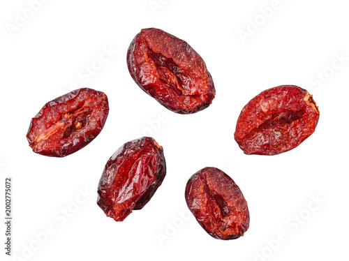 Obraz na płótnie Five plump and wrinkled dried cranberries, showcasing their rich red color and natural texture