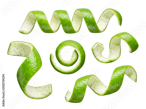 Photography Vibrant green lime peels, elegantly curled and twisted, isolated citrus zest for culinary and refreshing concepts