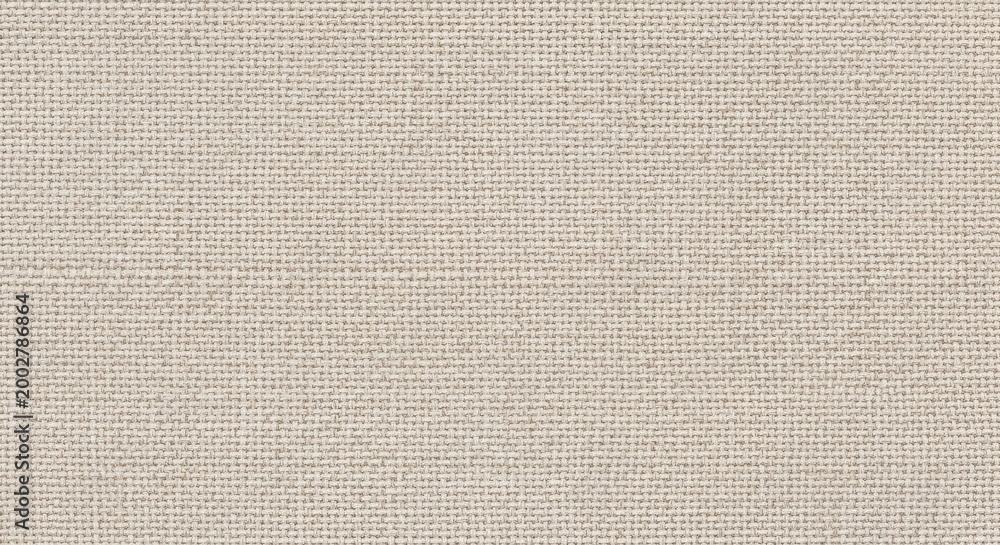 Fototapeta premium Close up view of beige fabric texture displays a consistent woven pattern.