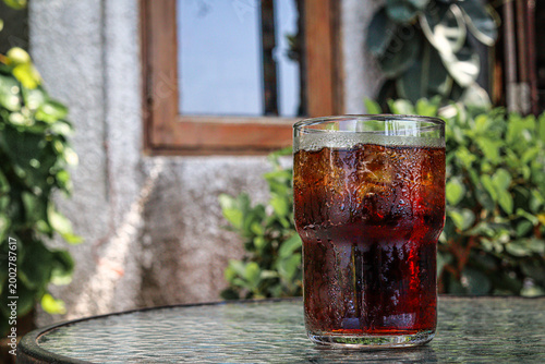 Cola drink with ice cubes