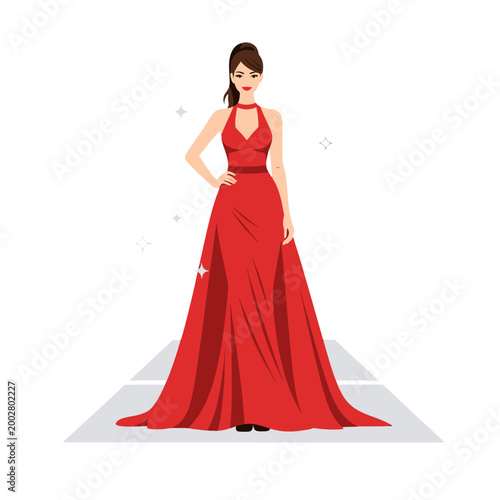 A beautiful woman in a long red evening gown stands on a runway