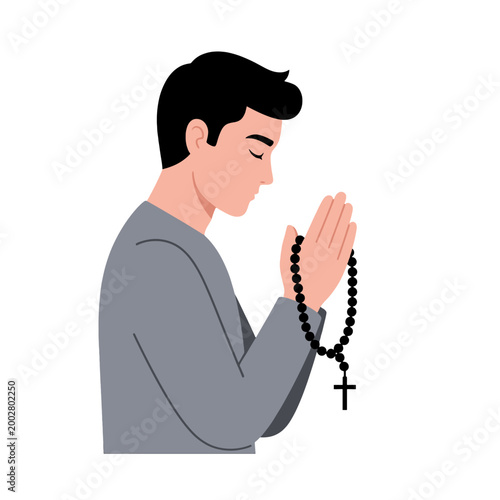 A young man is holding prayer beads while praying with his eyes closed in peace