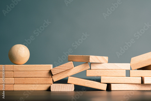 Obstacle ahead concept, wooden blocks forming uneven path with resistance, representing upcoming challenges, friction, and slowed progress in workflow or business process