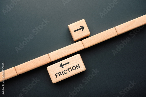 Friction concept, wooden blocks with opposite direction arrows representing resistance, obstacles, and inefficiency slowing down progress in business or workflow