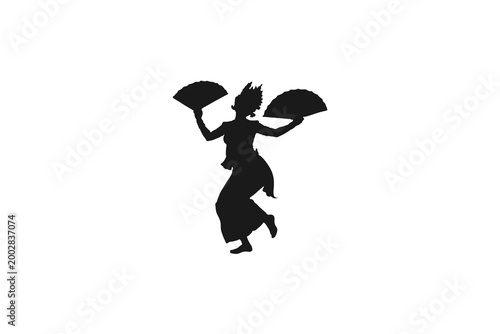 Silhouette of a Female Traditional Dancer Performing with Folding Fans