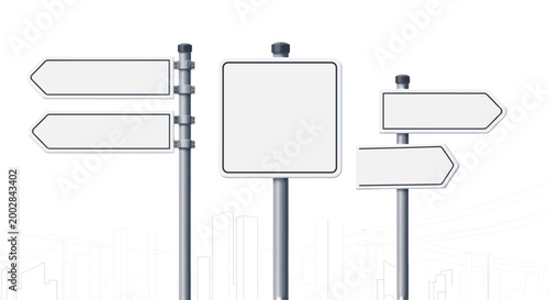 Set of various blank white road signs and direction arrows on metal poles for traffic and navigation concepts.