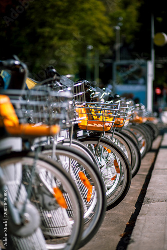 The street bikes are lined up in a row. 