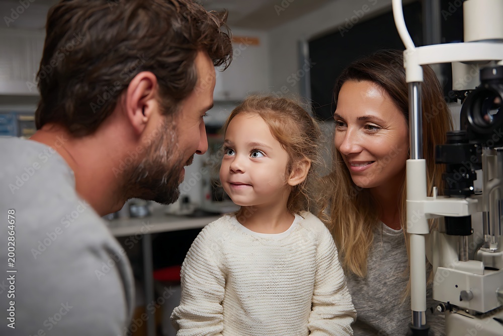 Fototapeta premium parent watching child during eye examination, supportive family moment, clinic environment,